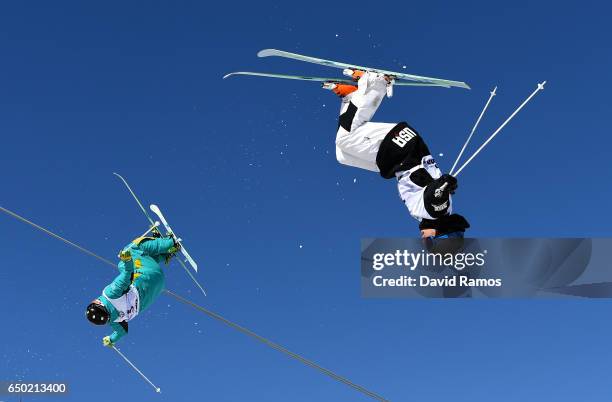 Dmitriy Reiherd of Kazakhstan competes with Bradley Wilson of the United States during the Men's Dual Moguls quarter final on day two of the FIS...