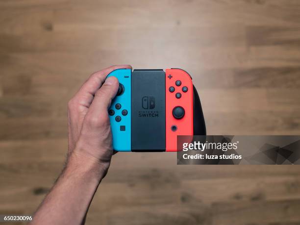 nintendo switch neon game controller - nintendo stock pictures, royalty-free photos & images