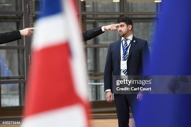 Members of the security team secure the arrival area of the Europa building at the Council of the European Union on the first day of an EU summit, on...