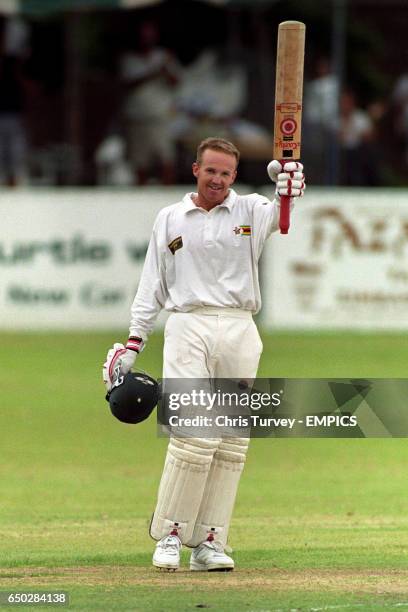 Zimbabwe's Andy Flower celebrates his century against England at the Queens Club in Bulawayo.
