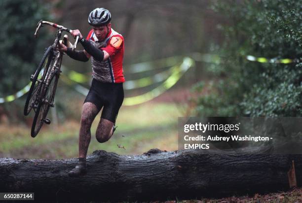 Rider jumps over a log