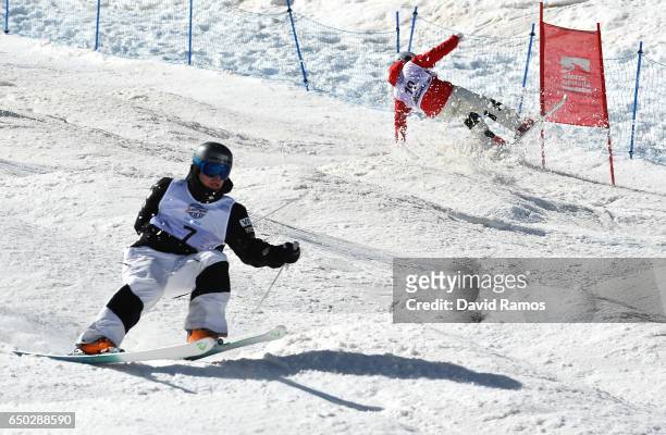Ikuma Horishima of Japan crashes with Bradley Wilson of the United States before going on to win the gold medal in the Men's Dual Moguls on day two...