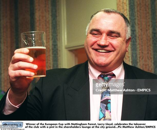 Winner of the European Cup with Nottingham Forest, Larry Lloyd, celebrates the takeover of the club with a pint in the shareholders lounge at the...