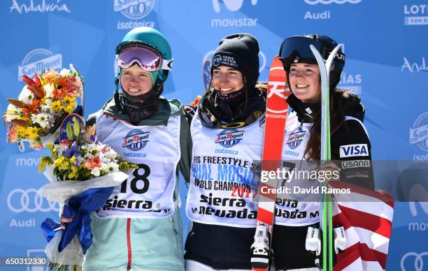 Perrine Laffont of France celebrates winning the gold medal with silver medallist Yulia Galysheva of Kazakhstan and bronze medallist Jaelin Kauf of...