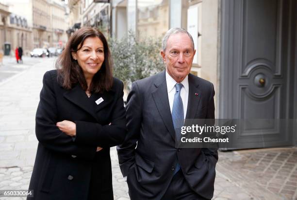 Former Mayor of New York City, Michael Bloomberg speaks with Paris City Mayor Anne Hidalgo in the Faubourg St Honore street after their meeting with...