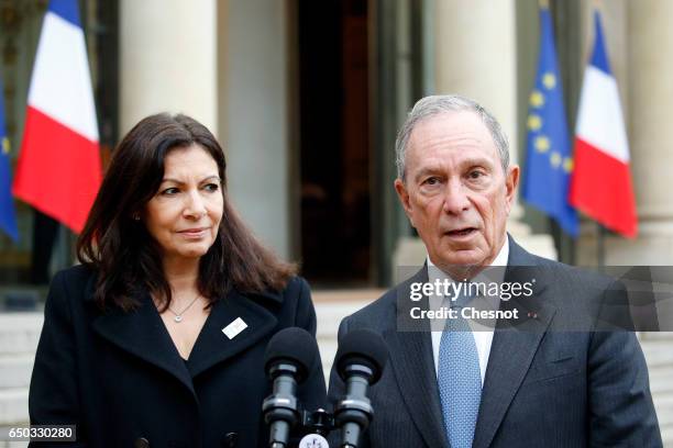 Former Mayor of New York City, Michael Bloomberg makes a statement flanked by Paris City Mayor Anne Hidalgo after their meeting with French President...