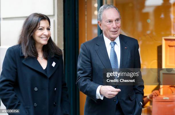 Former Mayor of New York City, Michael Bloomberg speaks with Paris City Mayor Anne Hidalgo in the Faubourg St Honore street after their meeting with...