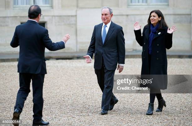 French President, Francois Hollande, former Mayor of New York City, Michael Bloomberg and Paris City Mayor Anne Hidalgo arrive for a meeting at the...