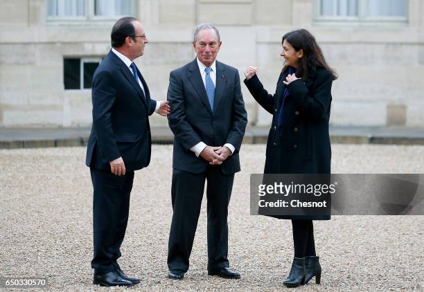 French President, Francois Hollande, former Mayor of New York City, Michael Bloomberg and Paris City Mayor Anne Hidalgo arrive for a meeting at the...