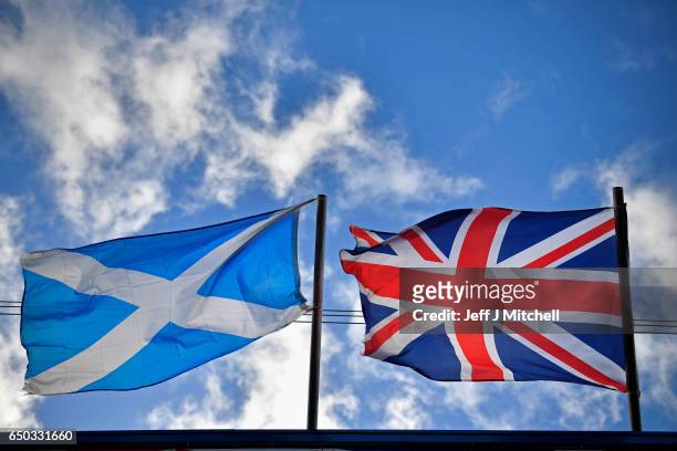 Saltire flag and Union Jack flutter in the wind on March 9, 2017 in Glasgow,Scotland. Nicola Sturgeon has said in an interview that the autumn of...