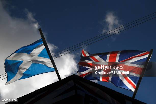Saltire flag and Union Jack flutter in the wind on March 9, 2017 in Glasgow,Scotland. Nicola Sturgeon has said in an interview that the autumn of...