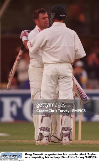 Greg Blewett congratulates his captain, Mark Taylor, on completing his century.