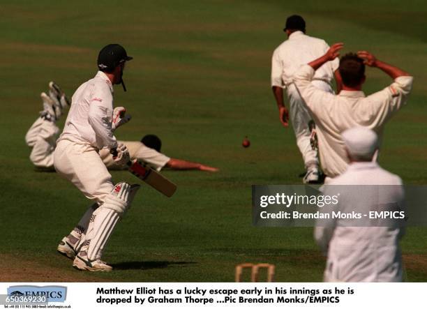 Matthew Elliot has a lucky escape early in his innings as he is dropped by Graham Thorpe.