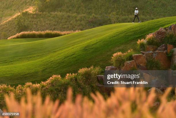 Jyoti Randhawa of India walks up the fiarway during the first round of the Hero Indian Open at Dlf Golf and Country Club on March 9, 2017 in New...