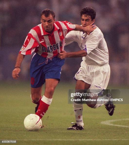 Radmilo Pantic Milinko Pantic of Atletico Madrid is held back by Raul of Real Madrid ...