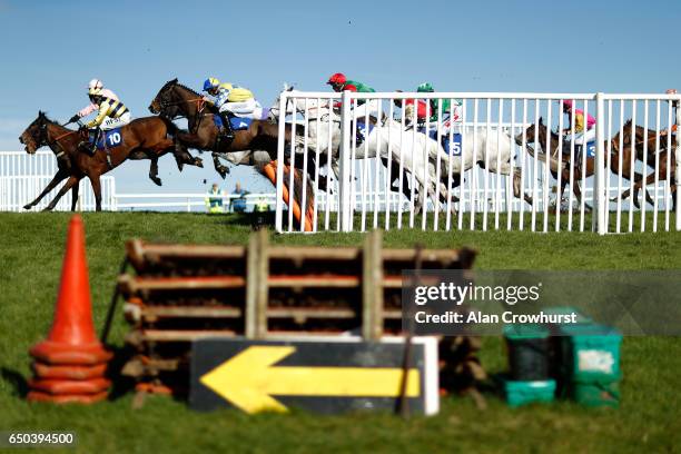 General view as runners clear a flight of hurdles in the back straight at Wincanton Racecourse on March 9, 2017 in Wincanton, England.