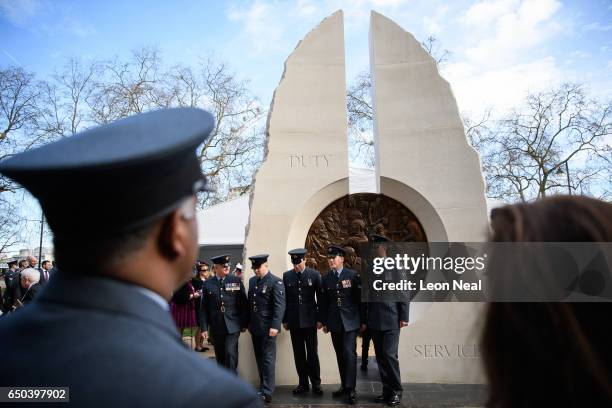 Servicemen and relatives gather around the new memorial to men and women from the UK Armed Forces and civilians who served their country in the Gulf...