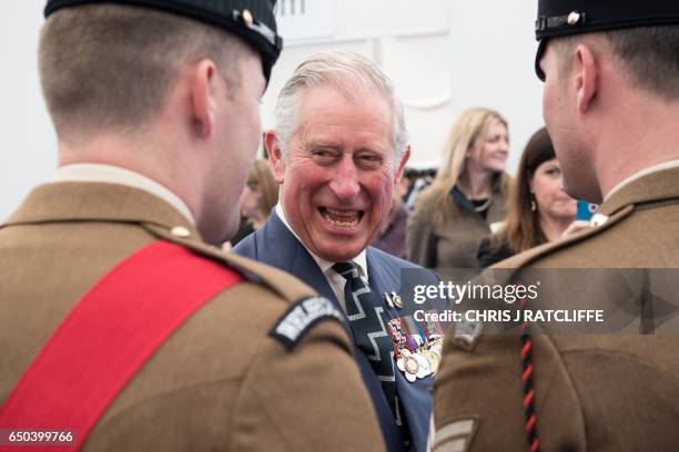 Britain's Prince Charles, Prince of Wales speaks with British military personnel, at a reception on Horse Guards Parade in central London on March 9...