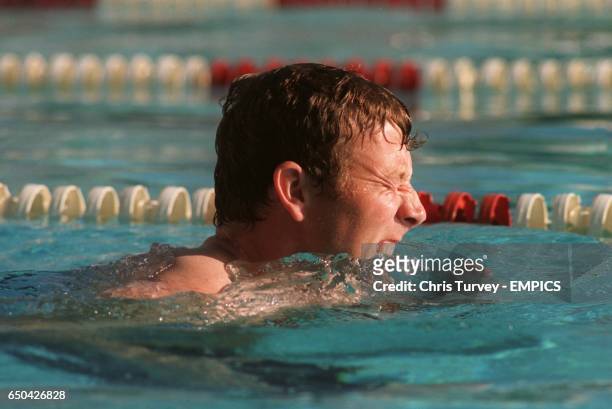 England captain Michael Atherton finds the aqua-jogging tough going