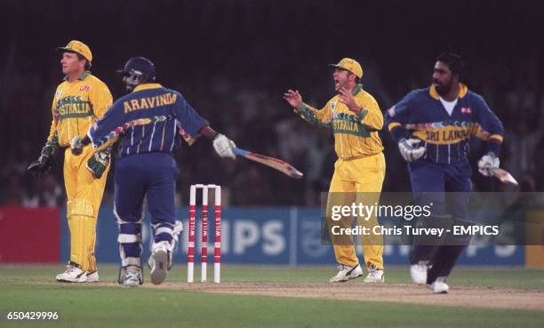 Mark Taylor of Australia can't believe it as Australia's Stuart Law drops a straightforward catch on the boundary from Asanka Gurusinha of Sri Lanka