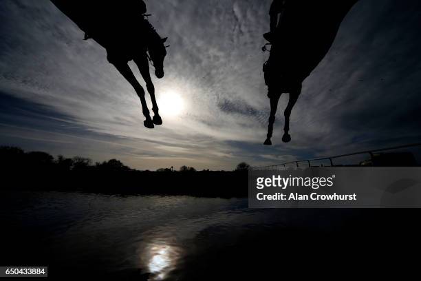 General view as a runner clears the water jump at Wincanton Racecourse on March 9, 2017 in Wincanton, England.