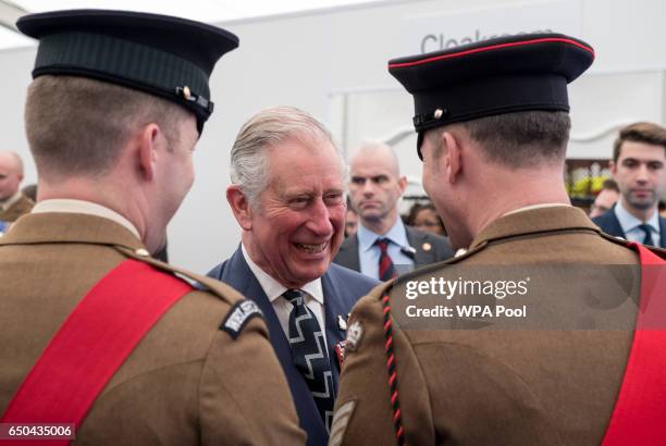 Prince Charles, Prince of Wales speaks with British military personnel at a reception following the unveiling of the new memorial to members of the...