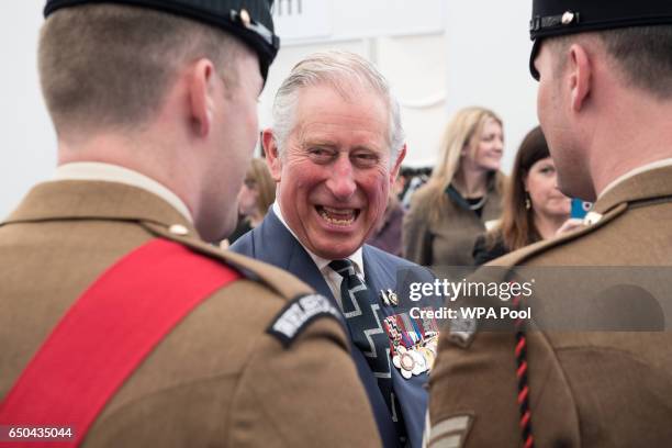 Prince Charles, Prince of Wales speaks with British military personnel at a reception following the unveiling of the new memorial to members of the...