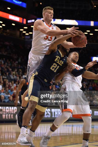 Jack Salt of the Virginia Cavaliers fights for a rebound against Sheldon Jeter of the Pittsburgh Panthers during the second round of the ACC...