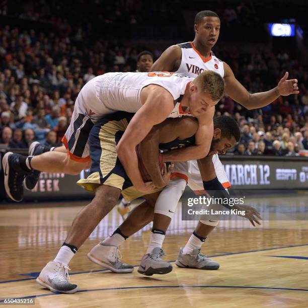 Jack Salt of the Virginia Cavaliers fights for a rebound against Sheldon Jeter of the Pittsburgh Panthers during the second round of the ACC...