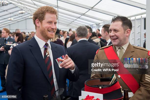 Prince Harry meets British military personnel at a reception following the unveiling of the new memorial to members of the armed services who served...