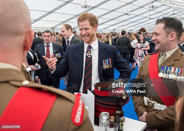 Prince Harry meets British military personnel at a reception following the unveiling of the new memorial to members of the armed services who served...