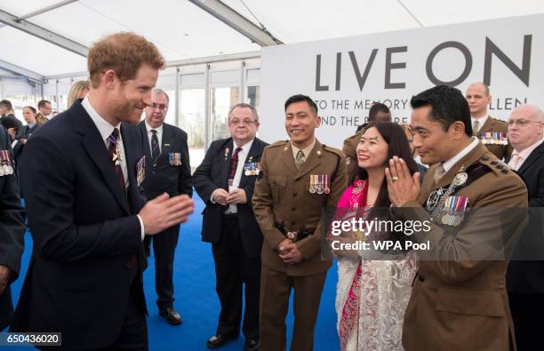 Prince Harry meets British military personnel at a reception following the unveiling of the new memorial to members of the armed services who served...