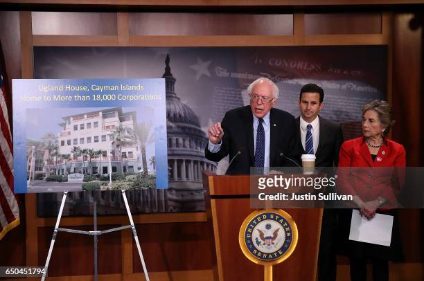 Sen. Bernie Sanders speaks as U.S. Sen. Brian Schatz and U.S. Rep. Jan Schakowsky look on during a news conference at the U.S. Capitol on March 9,...