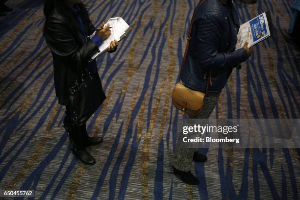 Job seekers wait to speak with recruiters during a Job News USA career fair in Overland Park, Kansas, U.S., on Wednesday, March 8, 2017. Applications...