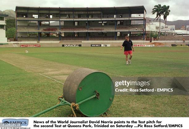 News of The World Journalist David Norrie points to the Test pitch for the second Test at Queens Park, Trinidad on Saturday