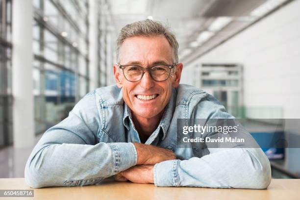 portrait of a creative man in an office environment. - one mature man only stock pictures, royalty-free photos & images