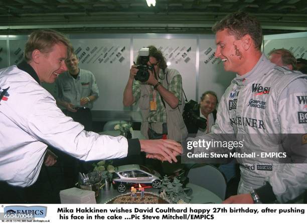 Mika Hakkinen wishes David Coulthard happy 27th birthday, after pushing his face in the cake