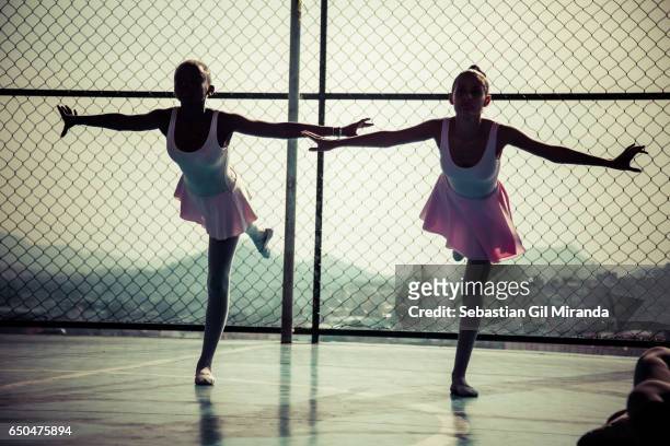 Ballet students in the project "Na Ponta dos Pés" , organized by a former professional ballerina, Tuany Nascimento, in Complexo do Alemão, a favela...