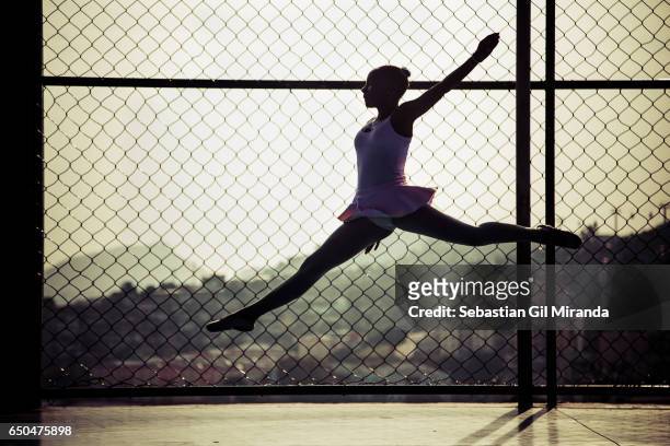 Ester, Tuany's sister, 12 years old, jumping during a class. Ballet student in the project "Na Ponta dos Pés" , organized by a former professional...