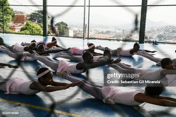 Ballet students in the project "Na Ponta dos Pés" , organized by a former professional ballerina, Tuany Nascimento, in Complexo do Alemão, a favela...