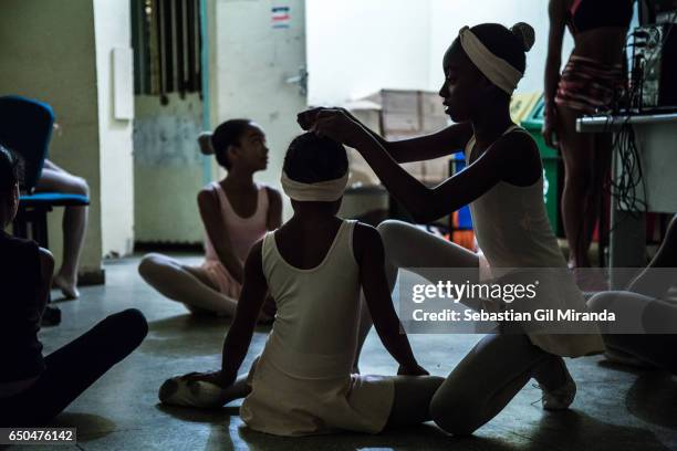 Ballet students in the project "Na Ponta dos Pés" , organized by a former professional ballerina, Tuany Nascimento, in Complexo do Alemão, a favela...