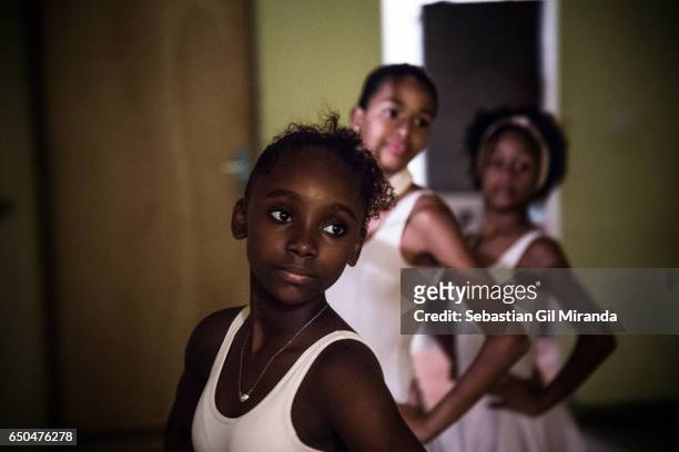 Ester, Tuany's sister, 12 years old, during a class. Ballet students in the project "Na Ponta dos Pés" , organized by a former professional...