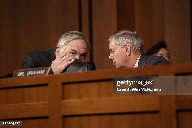 Sen. Luther Strange confers with Sen. Lindsey Graham as U.S. Central Command Commander Army Gen. Joseph Votel testfies before the Senate Armed...