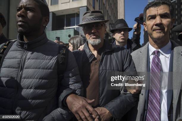 Immigration activist Ravi Ragbir, center, exits after a check-in with Immigration and Customs Enforcement at the Jacob K. Javits Federal Building in...
