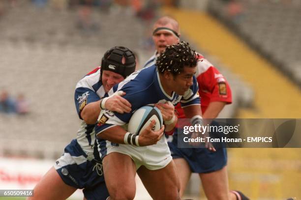 Halifax Blue Sox's Fereti Tuilagi is tackled by Sheffield Eagles' Johnnie Lawless