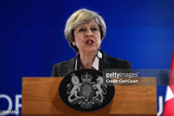 British Prime Minister Theresa May speaks during a press conference at the Council of the European Union, on the first day of an EU summit, on March...