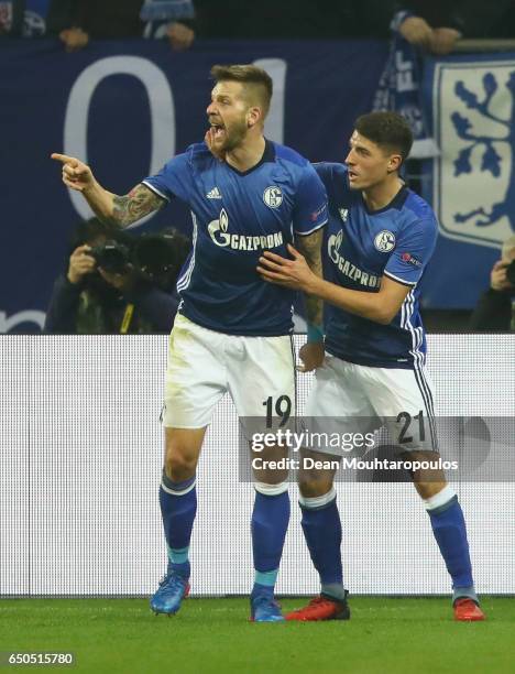 Guido Burgstaller of Schalke celebrates as he scores their first and equalising goal with Alessandro Schoepf during the UEFA Europa League Round of...