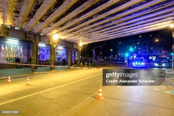 Police and emergency workers stand outside the main railway station following what police described as an axe attack on March 9, 2017 in Dusseldorf,...