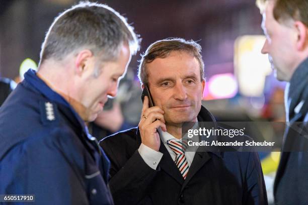 Lord Mayor of Dusseldorf Thomas Geisel is seen during police and emergency workers stand outside the main railway station following what police...