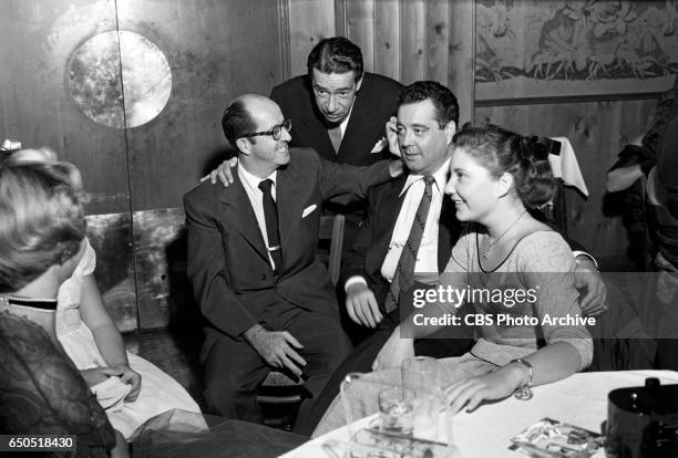 Jackie Gleason celebrates with guests, including Phil Silvers and daughter Geraldine Gleason at "The Jackie Gleason Show" after party at Toots Shors...